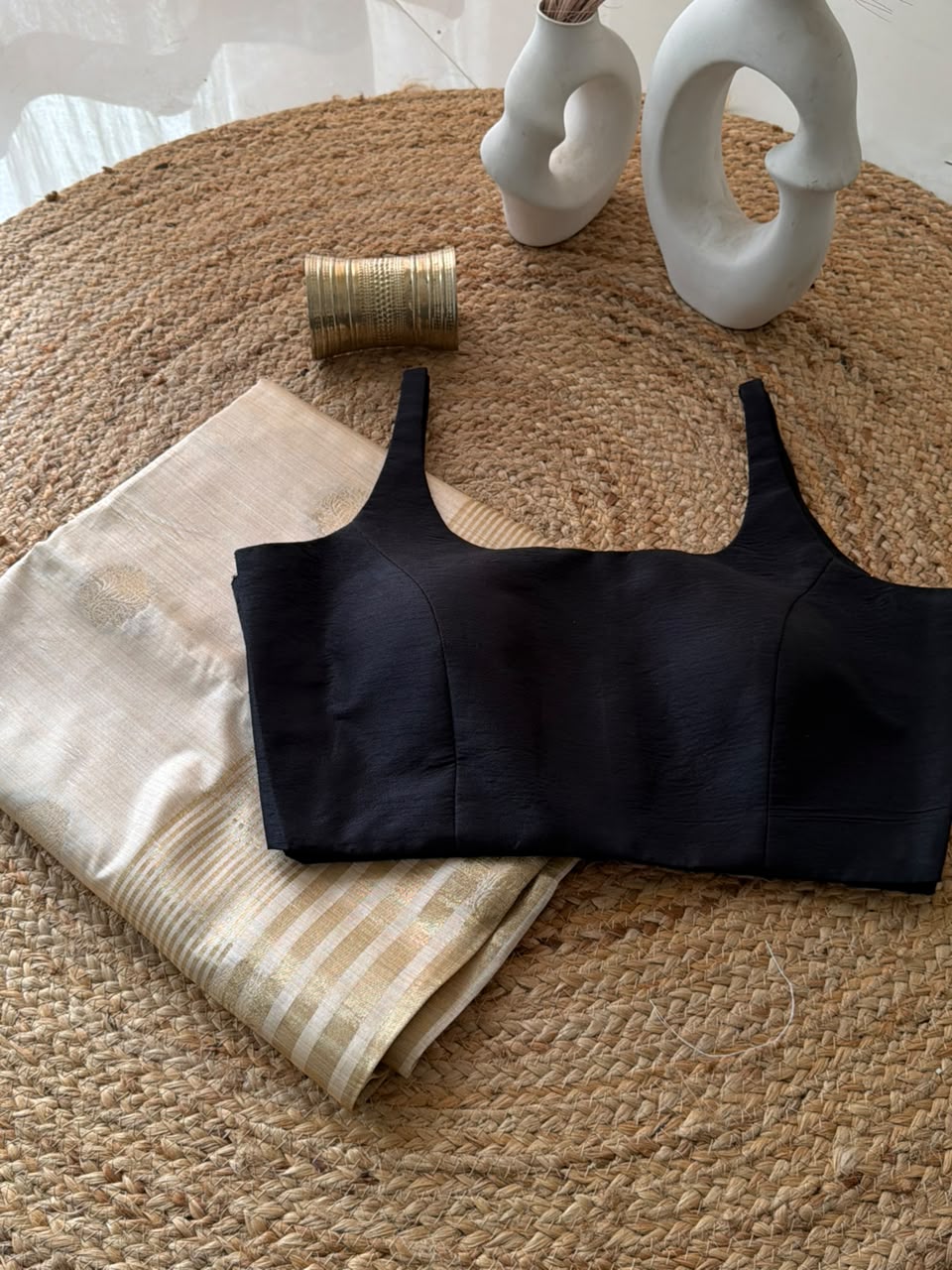 Sunheri Onam saree with Black scoop neck stitched blouse.