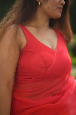 “Rangrez Pink orange” chiffon saree with stitched blouse.