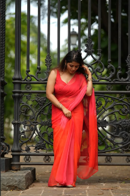 “Rangrez Pink orange” chiffon saree with stitched blouse.